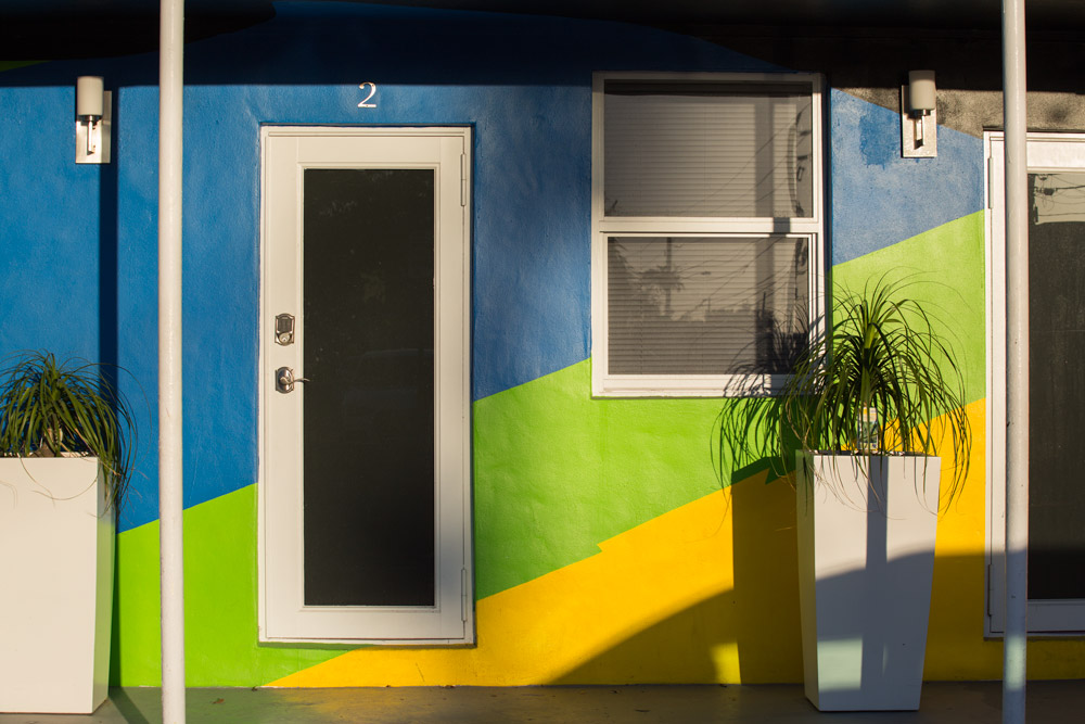Urban landscape in Miami Florida, yellow green and blue facade, colourful facade in Wynwood Miami. Facade with primary and complementary colors of the spectrumm