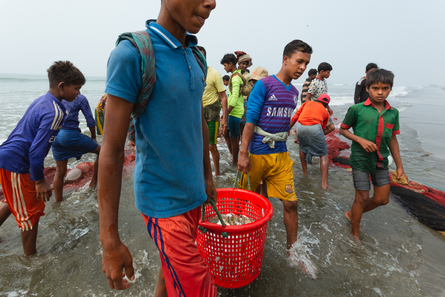 The workers of Bay of Bengal Cox’s Bazar Bangladesh transporting caught fish