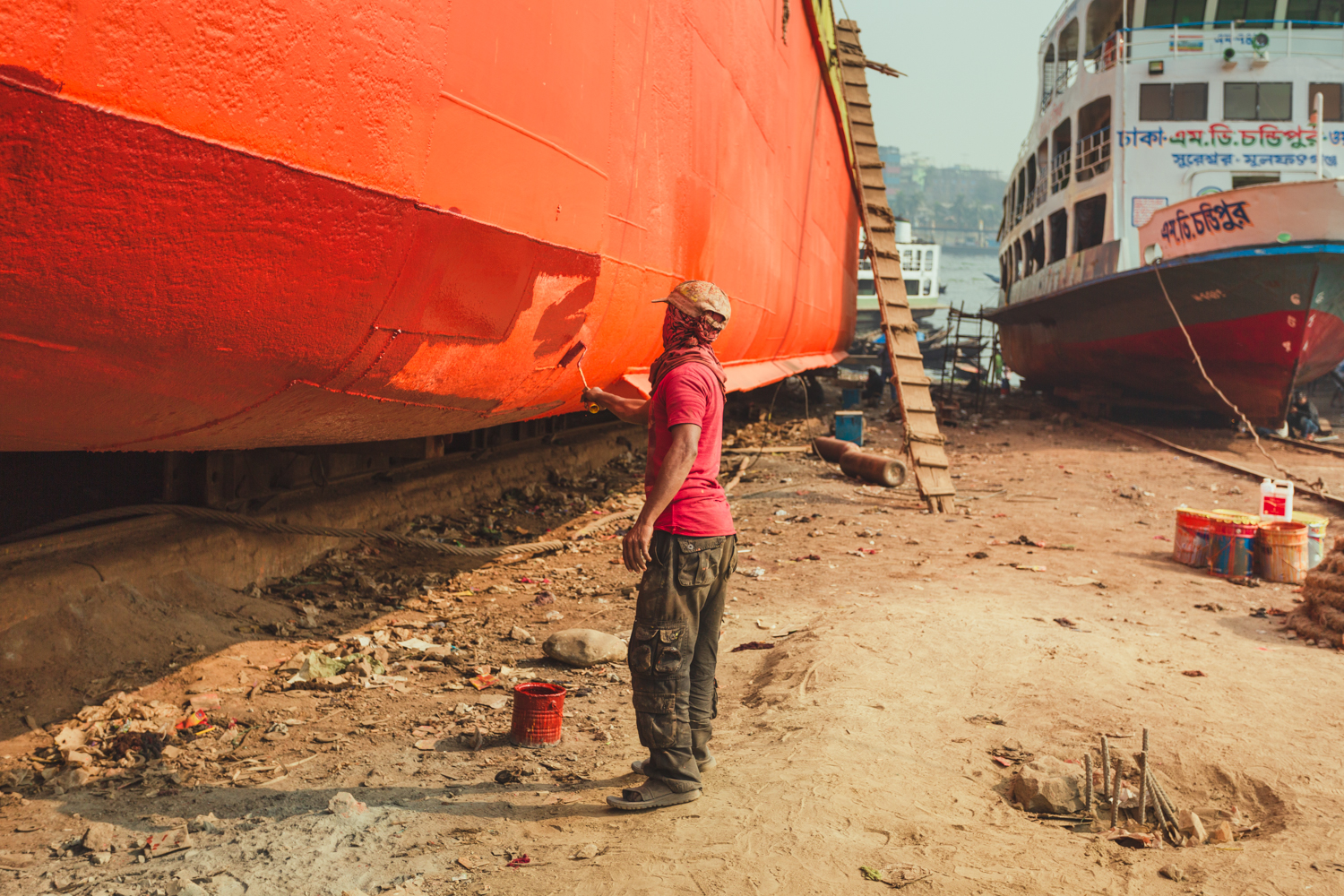 Final paint touches to ship at Dhaka, Bangladesh Shipyard.