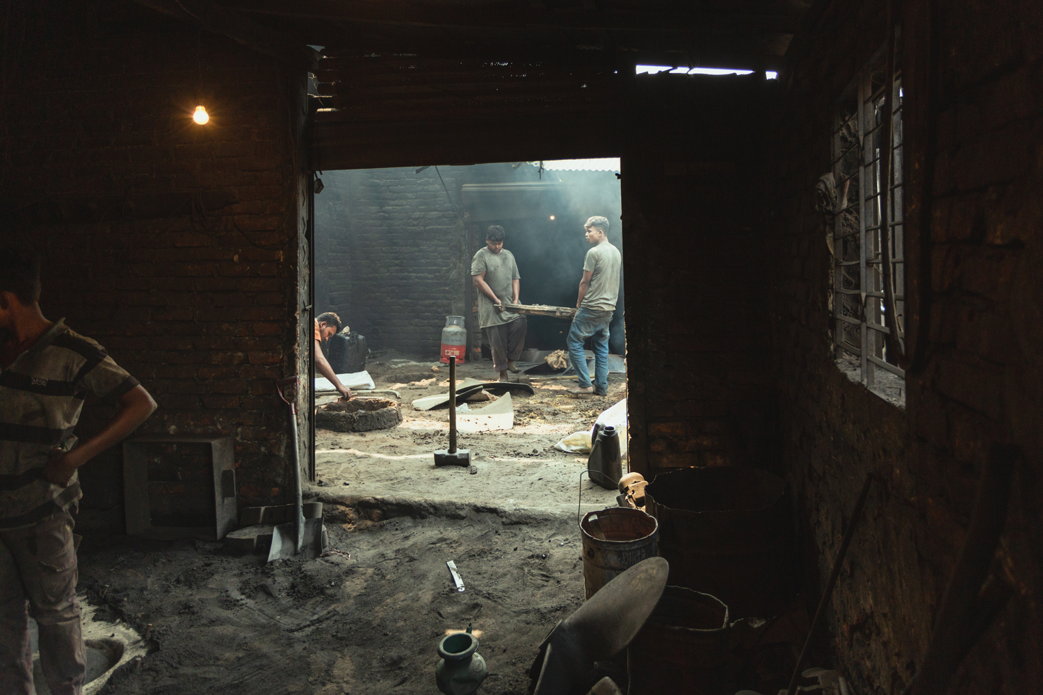 Workers making components for ship repairs at Dhaka, Bangladesh Shipyard.