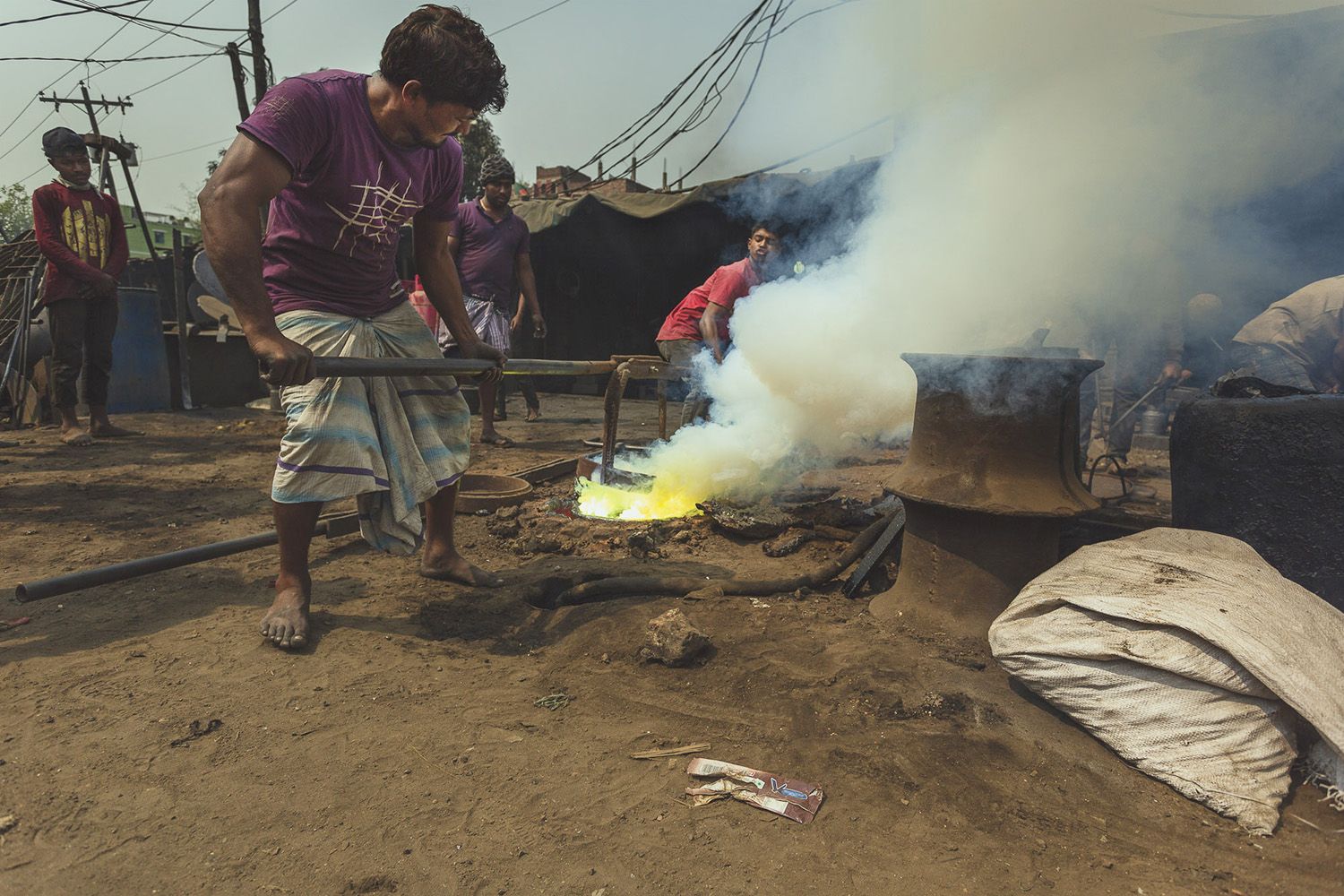 Heating tools are used to manipulate metal parts at Dhaka, Bangladesh Shipyard.