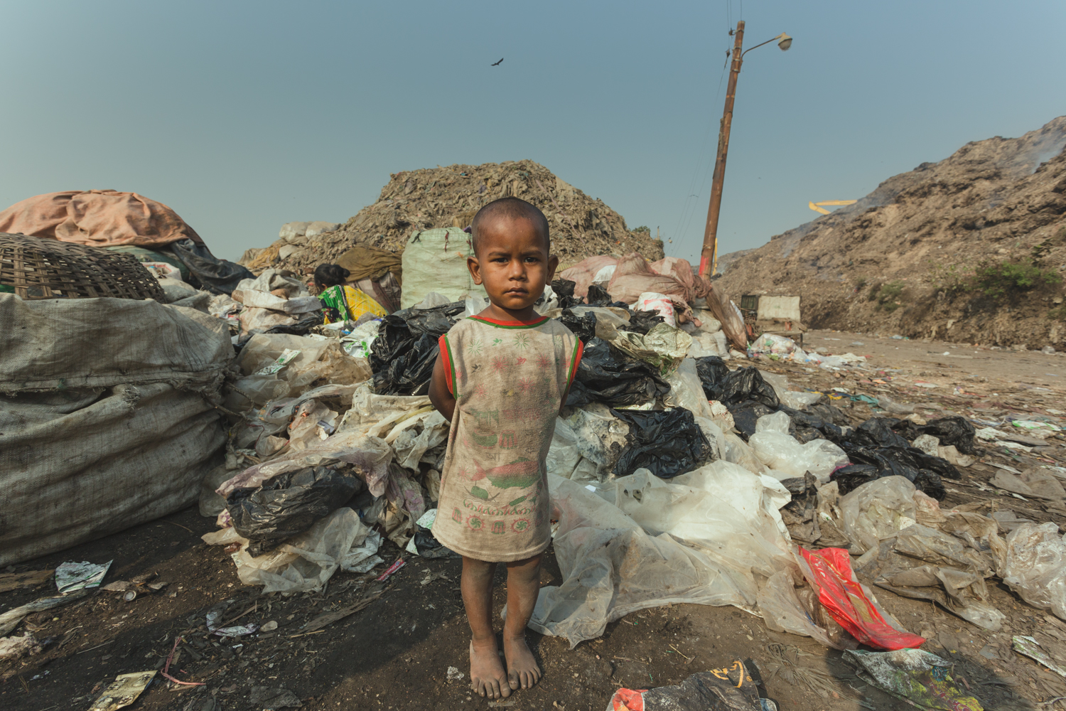 A child waits for the mother in Chittagong, Bangladesh.