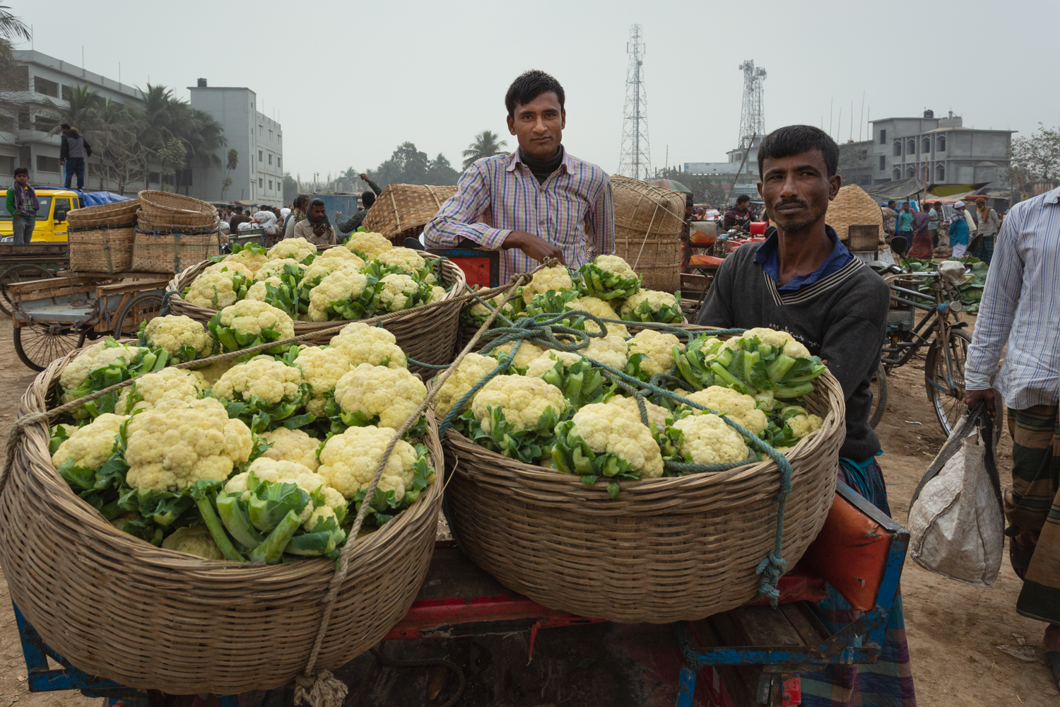 Sellers displaying their vegetables in baskets for sale at Dhaka, Bangladesh Vegetable Markets.