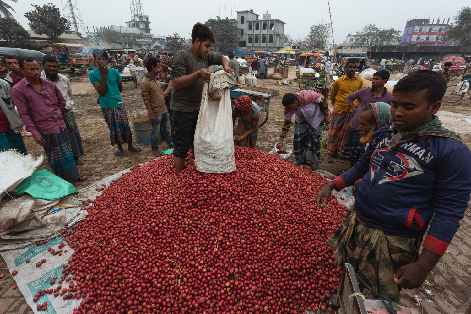 Buyers getting ready to purchase products at the Dhaka, Bangladesh Vegetable Markets.